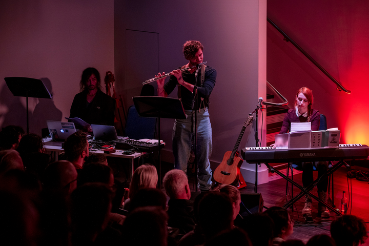 Subatomic by Christo Squier. A live concert with projections, a chamber orchestra and a lecture about subatomic particles at Science Gallery London.