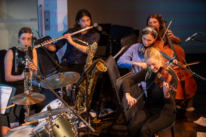 Subatomic by Christo Squier. A live concert with projections, a chamber orchestra and a lecture about subatomic particles at Science Gallery London.