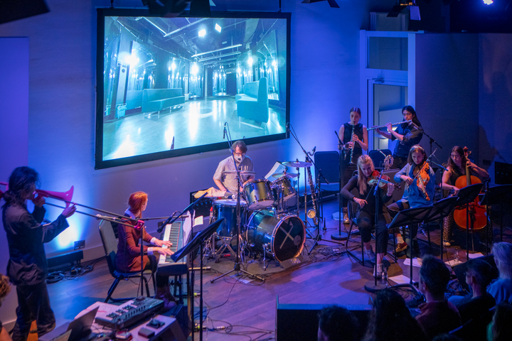 Subatomic by Christo Squier. A live concert with projections, a chamber orchestra and a lecture about subatomic particles at Science Gallery London.