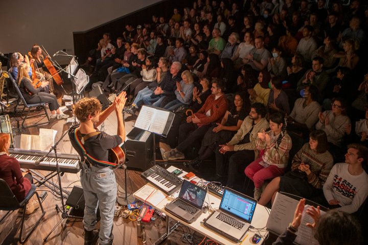 Subatomic by Christo Squier. A live concert with projections, a chamber orchestra and a lecture about subatomic particles at Science Gallery London.